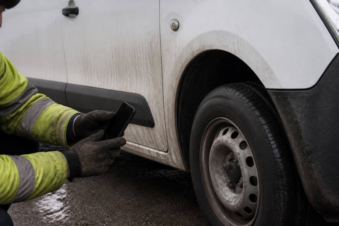 Technician inspecting a vehicle during a daily walkaround check